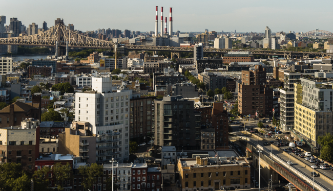 Traffic on Pulaski bridge in Long Island City. Panoramic view of Astoria, Roosevelt Island and Upper East Side Manhattan over the Queensboro Bridge.